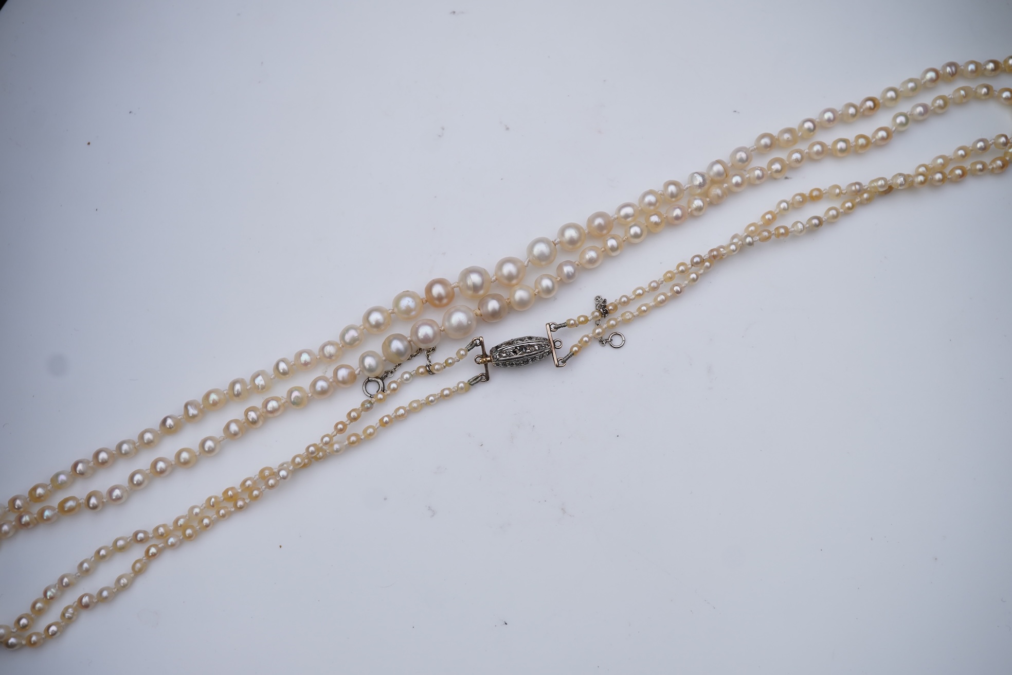 A natural pearl and diamond necklace, early 20th century